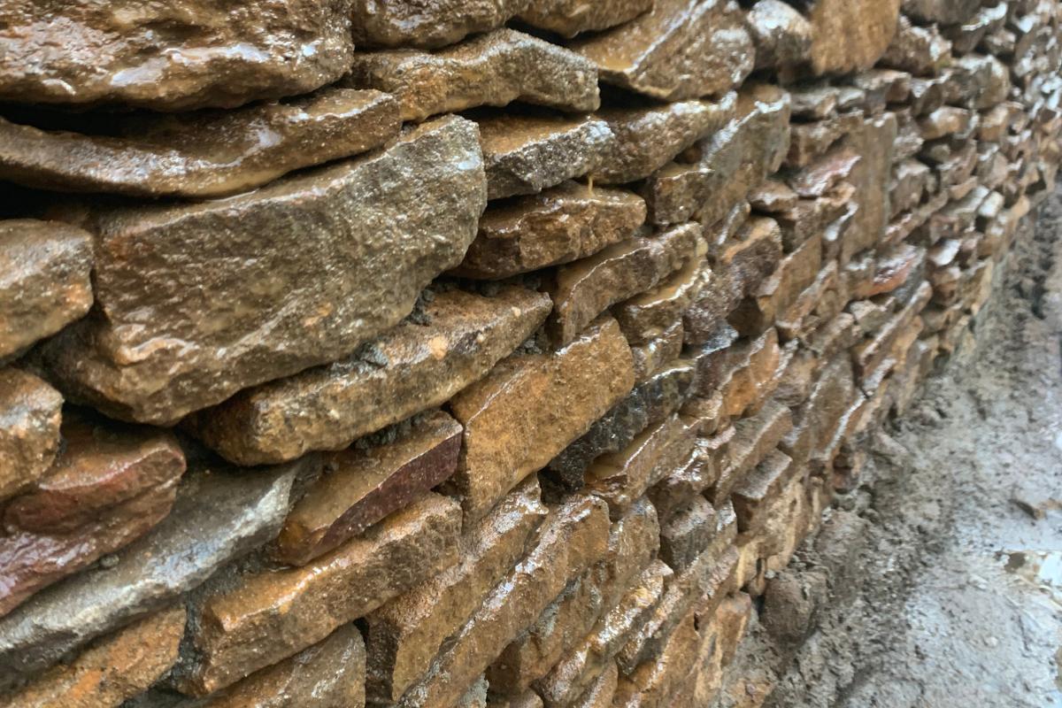 Dry-stacked ironstone garden retaining wall