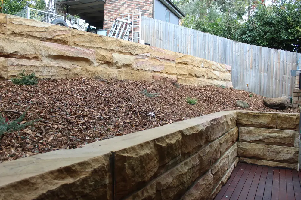 Blaxland front yard terraced into two levels with sandstone block retaining walls